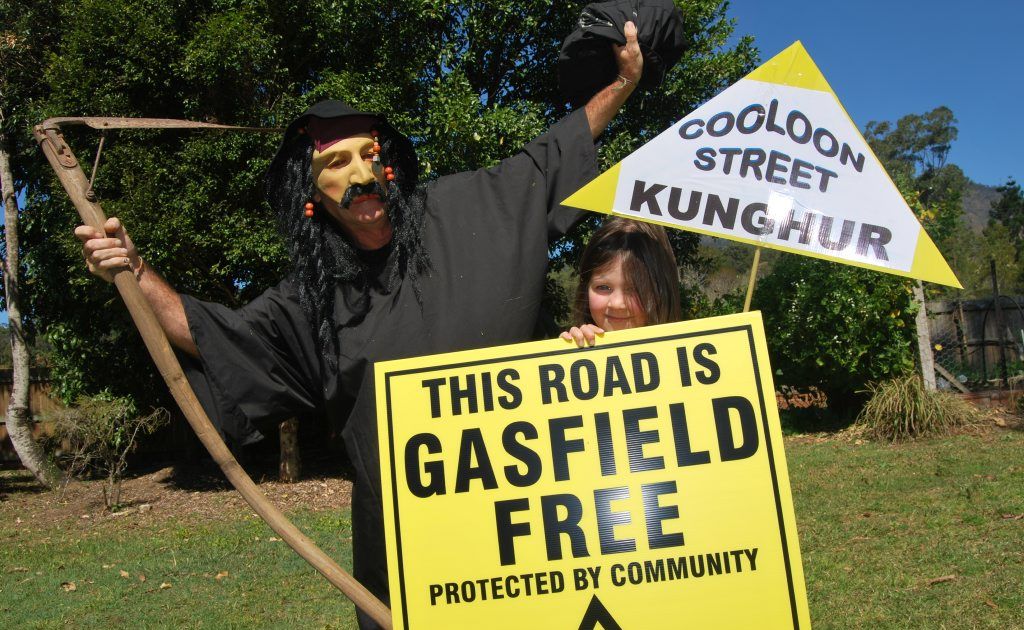Tweed Valley resident Audrey O'Donnell with the coal-seam gas threat, as depicted by the Grim Reaper, at Mount Burrell.
Tweed Valley resident Audrey O'Donnell with the coal-seam gas threat, as depicted by the Grim Reaper, at Mount Burrell.